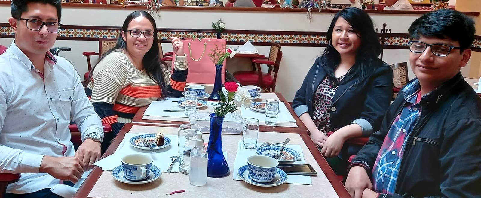 Four team members at a year-end breakfast.
